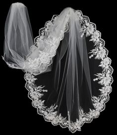 the veil is white and has flowers on it