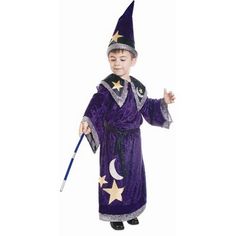 a little boy dressed up as a wizard with a wand and stars on his hat