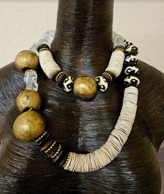 Women of Color will look fabulous in this exotic statement necklace set which can be worn together, separately or layered with your personal favorites. The asymmetrically set components add lots of interest and drama. I have another set done in similar colors which could be intermingled with this set for more styling variations (see the last photograph). The shorter strand adjusts from 16-19" while the longer strand adjusts from 25-28". Both are finished with silver tone hardware and lobster cla Bohemian Jewelry With Unique Design, Rocker Chic Accessories, Jewelry Vendor, Art Statement, Unique Pendant Necklace, Long Statement Necklace, Statement Bib Necklace, Organic Jewelry, Pagan Jewelry