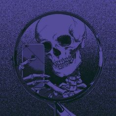 a skeleton is reflected in a magnifying glass with an electronic device next to it