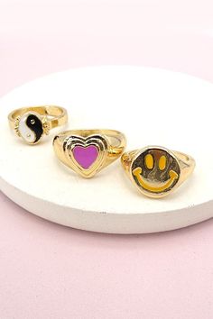 This stunning signet ring is featured in a shining style with a flat, circular face etched with a sweet epoxy smile, heart, yingyang rings.DIMENSION:size: 7Metal finish: Gold Platingproduct: Lead & Nickle Compliantanti-tarnish: Double E-coating Heart Ying Yang, Chic Shack, Y2k Rings, Pink Friday, Sunglass Chain, Red Leopard, Gold Signet Ring, Ying Yang, Monogram Initials