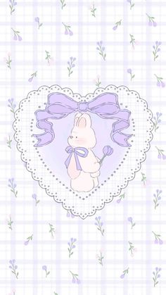 a heart shaped frame with a teddy bear on it and purple flowers around the edges