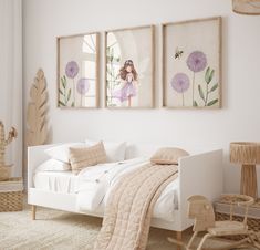 a white bedroom with three pictures on the wall