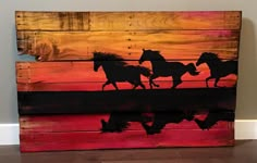 three horses running in the sunset painted on wooden pallet art work with water reflection