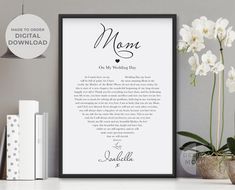 a framed print with the words mother of the bride on it next to some flowers