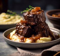 a plate with meat and mashed potatoes covered in gravy