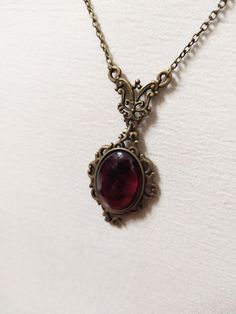 ◆ Victorian style necklace. The red blood cabochon size is 0.984252 x 0.708661 inches and it was completely handmade in resin. The inserts, the base and the chain are in bronze, The product is made by hand with great care. ♡ In my shop there are many handmade jewelry for all tastes, come and watch them are welcome! ♡ Red Amulet Necklace, Victorian Era Necklace, Victorian Oval Necklaces With Antique Finish, Victorian Oval Necklace With Antique Finish, Classic Red Oval Pendant Necklace, Victorian Cabochon Pendant Necklace, Victorian Pendant Necklace With Cabochon, Victorian Oval Pendant Gemstone Necklace, Victorian Oval Pendant Necklace With Gemstone