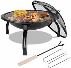 an outdoor bbq grill with tongs and barbecue accessories