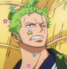 an anime character with green hair and stars on his face