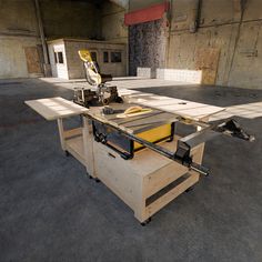 a workbench made out of plywood and wood with tools on the table