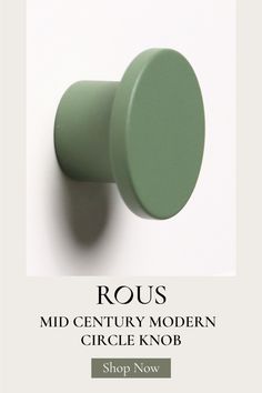 a green knob with the words rous mid century modern circle knob shop now