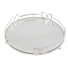 a round metal tray with bow handles