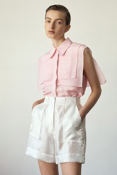 The Forget Me Not Sleeveless shirt in Rose is part of the PALMA MARTÎN 1_21 Most Serene collection. Beautifully lightweight, this nostalgic sailing inspired design is a collection favourite. The 2 layers of finely scalloped lapels on the front and back of the shirt, bring a serene softness to the overall look. The style has a concealed button front opening with a beautiful pearl button at the top of the placket. Relaxed fit silhouette. Model is wearing a Size 8 CARE INSTRUCTIONS Main: Linen / Si Garment Care Labels, Diy Vetement, Creation Couture, Online Fashion Boutique, Forget Me Not, Mode Inspiration, Sleeveless Shirt, Fashion Boutique, Sailing