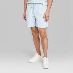 Seven-inch cargo shorts in a light aqua-blue shade. Made from lightweight, stretchy recycled fabric and tailored in a regular-rise cut with a regular fit for comfortable wear. The side and back pockets and two side cargo pockets provide enough space for everyday essentials. A front drawstring waistband completes the design and provides a customizable fit. If you're not satisfied with any Target Owned Brand item, return it within one year with a receipt for an exchange or a refund. Original Use™: Casual Cotton Swim Trunks With Built-in Shorts, Casual Swim Trunks With Built-in Shorts, Sporty Bermuda Cargo Shorts For Summer, Blue Cargo Shorts With Pockets For Summer, Spring Bermuda Athletic Shorts With Built-in Shorts, Sporty Summer Cargo Shorts, Light Blue Sporty Athletic Shorts For Summer, Casual Blue Swim Trunks With Built-in Shorts, Cotton Swim Trunks With Built-in Shorts