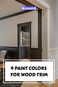 the paint colors for wood trim are white, black and gray in this living room