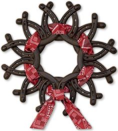 an ornament made out of horseshoes and ribbons