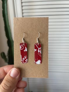 Fun handmade earrings featuring a red & white print  ❤️ made from recycled biscuit tins they're sustainably sourced & very lightweight! - 925 silver plated steel hooks - Size: 1x3cm Check out more of my earrings here: https://gracenicolexx.etsy.com **Please note that all of my items are handmade from recycled materials so please allow for small imperfections and slight variations in patterns & size** Handmade Earrings, Recycled Materials, Halloween Shopping, Print Making, Jewelry Earrings Dangle, 925 Silver, Silver Plated, Red White, Dangle Drop Earrings