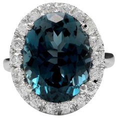 13.20 Carats Natural Impressive London Blue Topaz and Diamond 14K White Gold Ring Total Natural London Blue Topaz Weight: 12.00 Carats London Blue Topaz Measures: 16.00 x 12.00mm Natural Round Diamonds Weight: 1.20 Carats (color G / Clarity SI1) Ring size: 7 (we offer free re-sizing upon request) Ring total weight: 8.4 grams Disclaimer: all weights, measurements and colors are approximate and may vary slightly from the listed dimensions or as seen in the image. All pictures are magnified to show Tantalizing Teal, Emerald Cut Aquamarine Ring, Emerald Cut Rings, Etsy Gold Ring, 14k White Gold Ring, White Gold Ring, London Blue Topaz, London Blue, Quality Diamonds