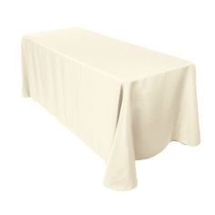 a white table cloth on top of a wooden table