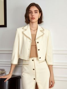 Editor's Notesyyiam curates feminine and classic daily outfits that suit well to modern women.- Crop jacket design- Made of tweed fabric- Button-down design- Vintage gold buttons- Feminine and sophisticated mood Measurements(in.)[S / M]- Length: 16.93 in. / 17.32 in. - Shoulder Length: 16.93 in. / 17.32 in. - Waistline: 31.89 in. / 33.46 in.- Bust: 38.16 in. / 39.76 in.- Sleeve Length: 18.90 in. / 19.29 in.* Model info: Size S / Height 5' 7 Composition & Care- Material: 78% Polyester, 20% Cotton, 2% Nylon- Light hand wash or dry cleaning recommended Designer- by yyiam Summer Tweed Suit, Luxury Spring Tweed Jacket With Button Closure, Elegant Button-up Tweed Jacket For Office, Beige Button-up Tweed Jacket For Work, Chic Cream Tweed Blazer, Chic Outerwear With Gold Buttons And Suit Collar, Chic Beige Tweed Jacket For Office, Elegant Beige Tweed Jacket With Lapel Collar, Elegant Tweed Jacket With Gold Buttons For Work