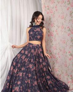 Description :A beautiful blue violet lehenga, flare illustrating floral imagery prints, paired with a halter blouse and a net dupatta with 4 side borders.The Lehenga can also be paired with a full-sleeve blouse, please connect to customiseColour : VioletFabric : Chanderi SlubCare : Dry Clean onlyFit : fit and flareThe model is wearing S size Blue Bohemian Sharara With Floral Print, Fitted Blue Floral Print Sharara, Unstitched Floral Print Choli For Party, Wedding Lehenga With Printed Motifs In Maxi Length, Wedding Lehenga With Printed Motifs, Floral Print Georgette Maxi Lehenga, Floral Print Georgette Lehenga Maxi Length, Festive Blue Choli With Printed Motifs, Party Lehenga With Floral Print In Maxi Length