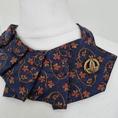 A vintage YSL tie that has been upcycled into an one of a kind detachable collar. Broen and gold vineyard grapes on navy. The front is in pristine condition, but the back has some age stains as you can see in pictures. It features a vintage button matching the pattern.   It fastens with a magnetic clasp. This statement collar makes the perfect Christmas or birthday gift. Ysl Vintage, Statement Collar, Vintage Ysl, Bib Collar, Scarf Vintage, Statement Accessories, Detachable Collar, Necklace Unique, Vintage Button