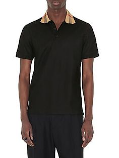 Crafted of cotton, Burberry's Cody polo shirt offers a classic look. The house's signature check print enhances the spread collar on this woven style. Spread collar Short sleeves Three-button placket 100% cotton Machine wash Made in Portugal SIZE  FIT Model measurements: 6'2 tall, 40 chest, 31 waist Model is wearing a US size Medium ABOUT THE BRAND Designer Collared Cotton Polo Shirt, Luxury Short Sleeve Polo Shirt With Striped Collar, Elegant Cotton Polo Shirt With Striped Collar, Designer Cotton Polo Shirt With Placket, Luxury Polo Shirt With Collared Neckline, Designer Collared Polo Shirt For Formal Occasions, Luxury Collared Polo Shirt For Formal Occasions, Luxury Cotton Polo Shirt For Formal Occasions, Luxury Formal Polo Shirt With Collared Neckline