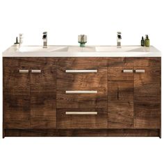 two sinks in front of a wooden cabinet