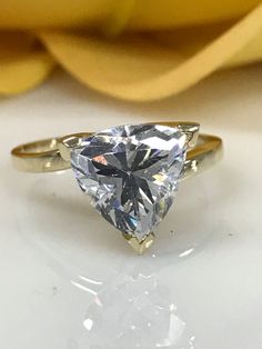 a ring with a pear shaped diamond on it