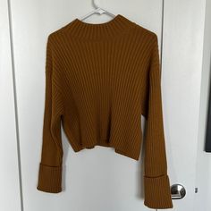 Never Worn, Perfect Condition. Cropped Sweater. Darker Brown Mustard Color Yellow Ribbed Sweater For Fall, Yellow Ribbed Long Sleeve Top, Yellow Ribbed Sweater For Winter, Spring Yellow Ribbed Sweater, Yellow Ribbed Long Sleeve Sweater, Yellow Long Sleeve Ribbed Sweater, Yellow Ribbed Winter Tops, Winter Yellow Ribbed Tops, Casual Yellow Ribbed Sweater