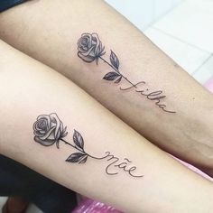 two rose tattoos on both legs with the word love written in cursive writing