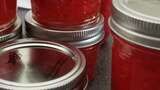 red jars are stacked on top of each other