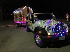 a jeep decorated with christmas lights and decorations