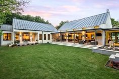 this is an image of a modern house in the country side view from the backyard