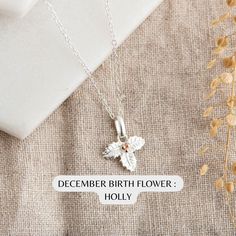 December Birth Flower Necklace : Sterling Silver Holly Necklace   Personalised Birthday Gift for Her - December Birthday Gift Idea Celebrate a December birthday with our exquisite sterling silver Holly Necklace. Each month of the year is associated with a special flower. December's flower is the holly. It symbolizes hope, protection, and everlasting life. The holly's leaves and berries capture the essence of the season and the people born in December.  ★ Product Details: * Material: sterling sil People Born In December, December Flower, December Birth Flower, Born In December, December Birthday Gifts, Birth Flower Necklace, December Birthday, Special Flowers, Everlasting Life