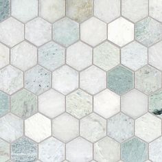 a white and grey hexagonal tile pattern with green accents on the bottom half