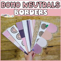 a person holding up several pieces of paper with the words boho neutrals borders