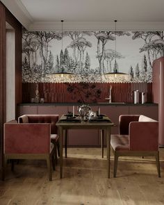 a dining room with pink chairs and wallpaper