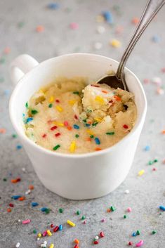 a cup filled with ice cream and sprinkles