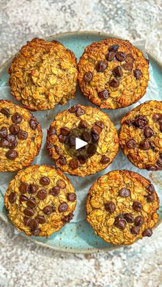 several cookies on a plate with chocolate chips and oatmeal in the middle