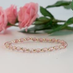 This charming stretch bracelet features the warm, enchanting hues of strawberry quartz and the luxurious shine of 14K gold filled beads. Key Features: Warm Strawberry Quartz Beads: Each strawberry quartz bead showcases rich, reddish-pink tones with a hint of sparkle. Known for its uplifting energy and beauty, strawberry quartz brings warmth and a unique charm to the bracelet. Luxurious 14K Gold Filled Beads: Interspersed between the strawberry quartz beads, the 14K gold filled beads provide a ri Elegant Pink Stackable Stretch Bracelet, Gold Rose Quartz Beaded Bracelets As Gift, Gift Rose Quartz Beaded Bracelets In Gold, Spiritual Gold Beaded Rose Quartz Bracelets, Gold Rose Quartz Beaded Bracelets, Gold Rose Quartz Beaded Bracelets With Round Beads, Gold Beaded Bracelets With Rose Quartz Round Beads, Gold Beaded Bracelets With Rose Quartz, Gold Beaded Bracelet With Rose Quartz Round Beads