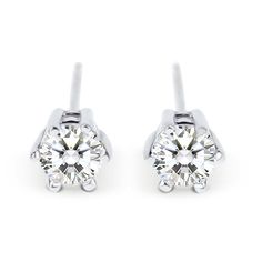 Sweet and simple, these stud earrings reflect your refined, sophisticated elegance. Each showcases a round stone in a traditional six-prong setting. Perfectly sized for her little ears, these classic and elegant stud earrings are a smart and stylish look anytime.Carat Weight: 0.55 ctStone Size: 4 mmStone Type: Jeulia® StoneNumber of Stones: 2 Stone Color: Diamond WhiteStone Shape: RoundWeight: 2 gWidth: 5.47 mmHeight: 4.34 mmMaterial: 925 SilverPlating Color: Silver Classic Round Diamond Earrings For Everyday, Classic Everyday Round Diamond Earrings, Classic Formal Earrings With Tension Setting, Elegant Diamond Earrings With Tension Setting, Classic Round Stone Diamond Earrings As A Gift, Classic Formal Earrings With Round Stone, Classic Diamond White Round Stone Earrings, Classic Sterling Silver Earrings With Tension Setting, Classic Everyday Diamond Earrings With Matching Set