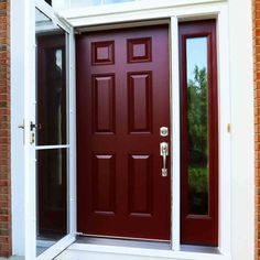 a red front door with two sidelights