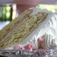 a close up of a slice of cake on a plate with frosting and icing