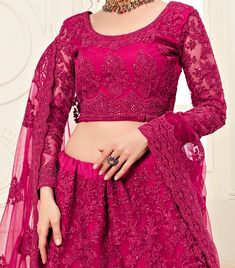 COLOR : Magenta Pink FABRIC : Top (Blouse) - Net, Bottom (Lehenga) - Net, Inner - Silk Satin & Premium Can-Can, Dupatta - Net WORK : Heavy Silk Thread Embroidery, Heavy Stone Work, Cutwork, Cording Embroidery OCCASION : Wedding, Reception, Sangeet, Engagement READY-TO-WEAR : NoSTITCHING : Available as semi-stitched fabric, can be stitched using standard size option (+$30). Note: There might be a slight color variation due to lighting and flash used during photoshoot. The bright shade seen is the Cording Embroidery, Embroidered Bridal Lehenga, Red Lehenga Choli, Rani Pink, Indian Outfits Lehenga, Net Lehenga, Pink Lehenga, Red Lehenga, Indian Bridal Dress