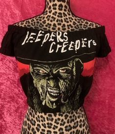 "Jeepers Creepers  Horror Off Shoulders Elasticized Crop Top.  Made from brand new Men's T shirt. It was transformed into cute off shoulders crop top.  Available in all sizes: Small, Medium, Large, XL. Measurements: Small -  31/33\" Bust, 26/27\" Ribcage  Medium- 34/36\" Bust. 28/30\" Ribcage  Large- 36/38\" Bust, 30/32\" Ribcage  X-Large- 38/40\"  Bust,  32/34\" Ribcage  If you have any questions, please feel free to message me. All items will ship within 3 days of payment received." Jeepers Creepers, Off Shoulder Crop Top, Sun City, Photo Op, Rib Cage, Shoulder Crop Top, Creepers, New Man, Off The Shoulder