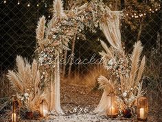 an outdoor wedding set up with candles and flowers