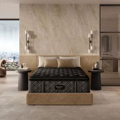 a bedroom with a large bed in the middle of it and a view of the city