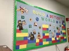 a bulletin board that says build a better world with legos and pictures on it