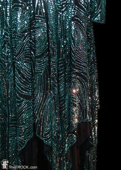 Halston 1970s sequined evening dress, hankie hem, blue / green teal color, plunging open back / back Holiday Sequin Flapper Dress For Costume Party, Fitted Green Flapper Dress For Party, Embellished Evening Dress For Festivals, Embellished Sequin Dress For Costume Party And Holiday, Green Embellished Dress For Festivals, Elegant Sequined Dresses For Festivals, Elegant Evening Dresses For Festivals, Elegant Evening Festival Dresses, Silver Dresses For Festive Occasions